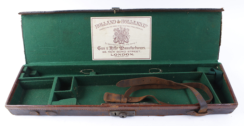 Red leather gun case, handle to hinge side, Holland & Holland trade label, green baize lined