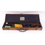 Canvas and leather gun case with brass corners, baize lined fitted interior for 30 ins barrels,