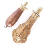 Copper and brass relief decorated powder flask by Hawksley, of escutcheon form,