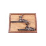 Pair of scroll and banner engraved percussion locks by W. J.
