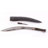 Kukri knife, 14 ins decorated blade, brass mounted wood grips,