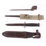 Spike bayonet with metal scabbard and frog; fighting knife with 7 ins blade, ring turned grips,