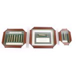 Three framed rifle cartridge displays: 'Dangerous Game'; '600 Nitro Express'; '.