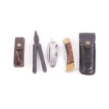 Buck folding lock knife, 3½ ins blade, brass and wood grips, in leather case,