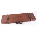 A good leather gun case with green baize lined fitted interior for 31 ins barrels, embossed CAPT. V.