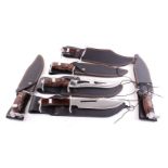 Seven Protector knives in sheaths