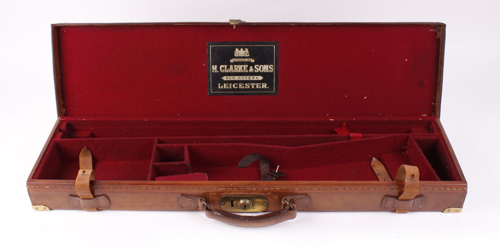 Leather gun case with brass corners, claret baize lined fitted interior for 30 ins barrels, H. - Image 2 of 2