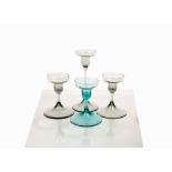 Attributed to Hans Eric Anderson for Dartington Glass, a trio of short, footed candlesticks, pattern
