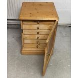 A 19th Century waxed pine collector's cabinet, single door reveealing six drawers, 57 cm x 59 cm x