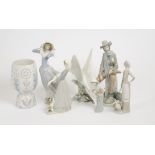 A collection of Lladro figures, consisting of a dove, a windswept woman, a musician and three farm