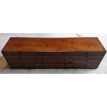 A 19th Century mahogany table top cabinet, 12 graduated drawers, 95 cm wide x 23 cm deep x 26 cm