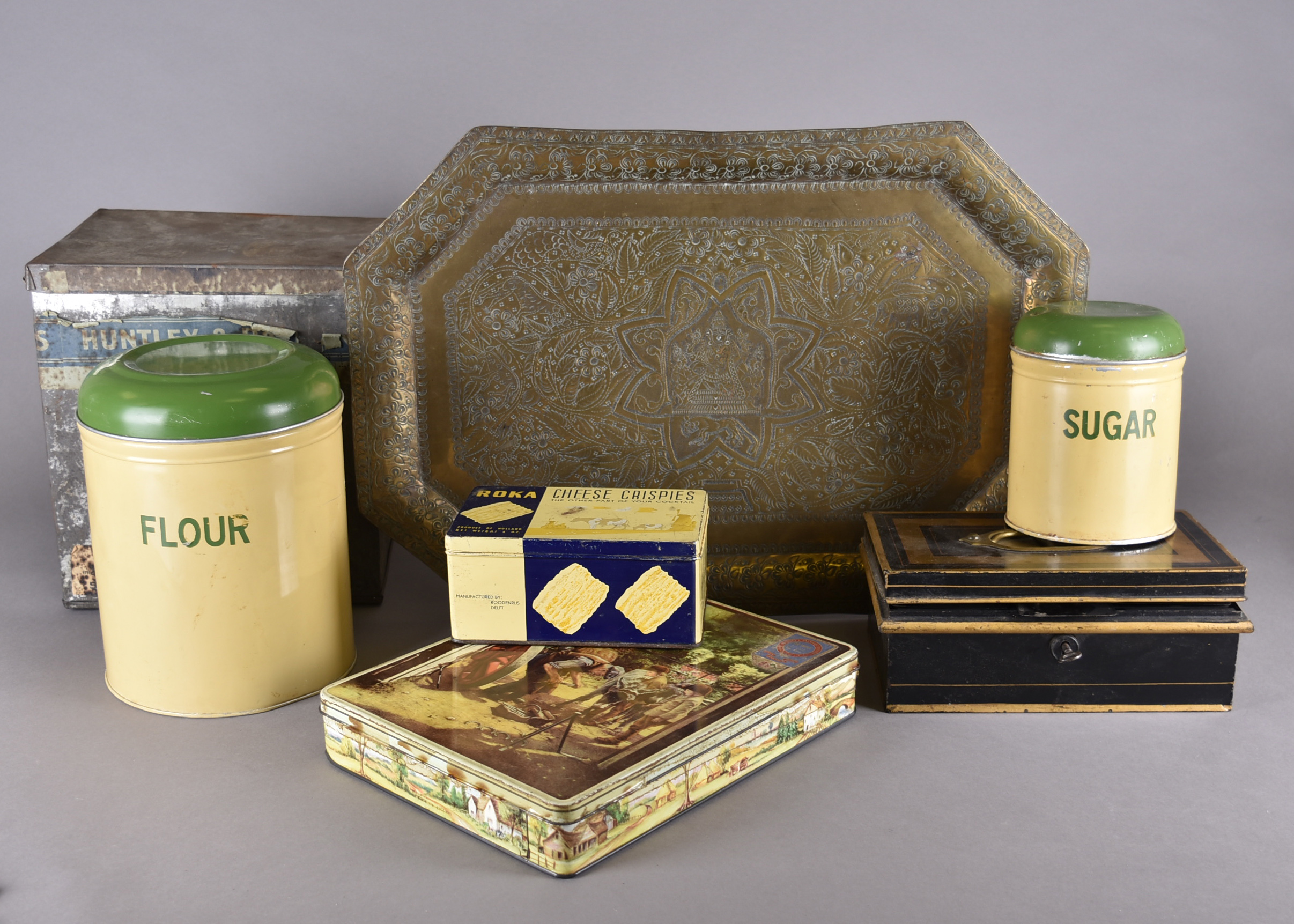 A collection of early 20th Century tins and metalware, including a cash box, Huntley and Palmer