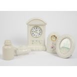A group of Belleek, including an 8th period mantle clock, arched pediment, shamrock decoration, 25