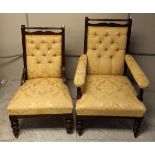 A pair of late 19th Century mahogany gentleman and lady's button backed chairs, yellow floral