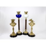 A pair of Victorian converted oil lamps, one with blue glass reservoir, the other with opaque white,