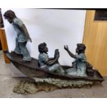 A contemporary bronzed garden sculpture of three boys in a fishing boat, indistinctly signed and