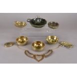 A small quantity of metalware, including four Middle-Eastern brass bowls, a silver plated model of a