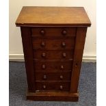 A miniature mahogany Wellington chest, six graduated drawers, 36 cm wide x 26 cm deep x 56 cm