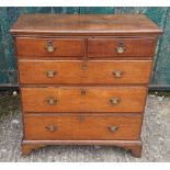 An antique oak chest-of-drawers, two short over three graduated long drawers, bracket feet, in two