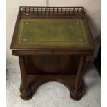 A 19th Century rosewood Davenport, tooled green leather top, fitted interior, pierced gallery, two