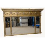 A modern Regency style gilt overmantle mirror, three bevelled glass plates, below swag and rosette