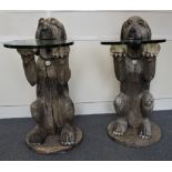 A large pair of carved wooden console tables modelled as begging dogs, glass circular tables, 112 cm