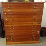 A 20th Century pine four tier plan chest, brass handles, four drawers to each section, 152 cm wide x