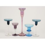 A small group of assorted saucer and pan topped candlesticks, one of heavy gauge in iridised pink,