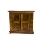 A 19th Century Continental walnut miniature armoire, with string inlay, brass escutcheon and bun