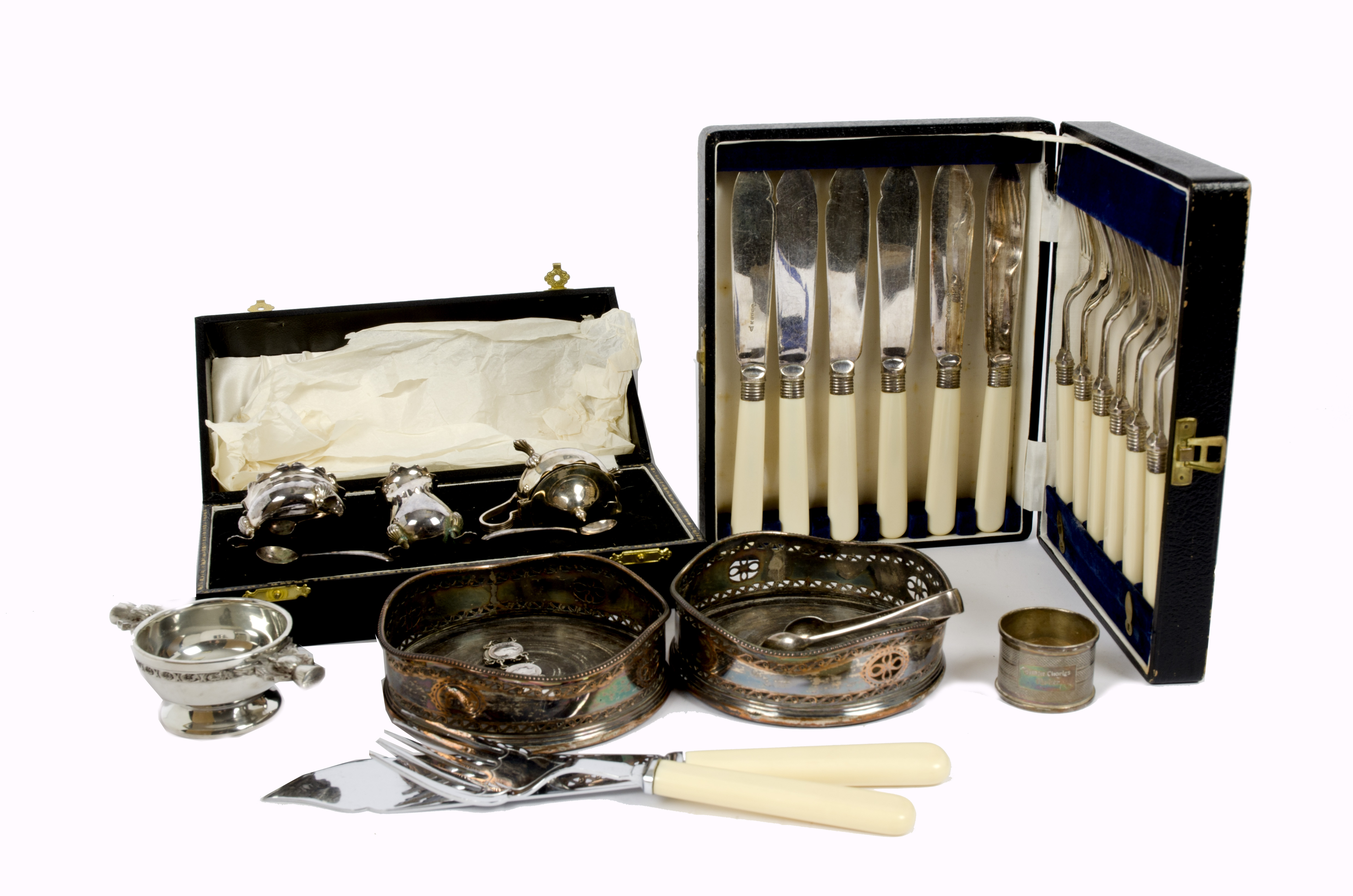 A collection of silver and silver plate, including silver napkin rings, silver sugar tongs, a pair