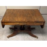 A Regency rosewood sofa table, four drawers, quadraform base, lion paw feet with casters, 152 cm