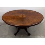 A Victorian walnut mahogany and inlaid loo table, supported by four columns and splayed legs, 119 cm