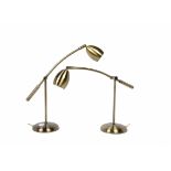 A pair of modern Scandinavian brass desk lamps, adjustable arms and heads, circular base (2)