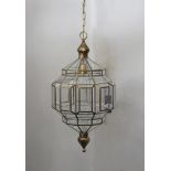 A contemporary Moroccan style faceted ovoid glass and brass hall lantern, 102 cm high