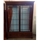 A 19th Century mahogany large two section glazed display cabinet, two glazed panel doors revealing