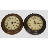 Two George V GPO wall clocks, slave movements, circular dials, Roman numerals, each 28.5 cm