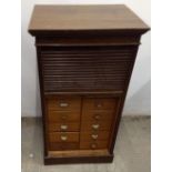 An early 20th Century oak tambour front file cabinet, 16 drawers, 62 cm wide x 48.5 cm deep x 115 cm