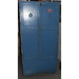 A mid 20th Century blue painted metal and wood workshop cabinet, panelled doors one with interior