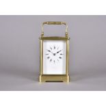 An Edwardian brass repeater carriage clock, by Schwarck, brass case, white enamel face, Roman