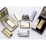 A group of nine 1960s and later cigarette lighters, including a 1970s gilt Dunhill example in a box,