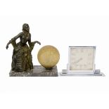 An early 20th Century French table lamp, spelter lady in crinoline, crackled yellow glass globe,