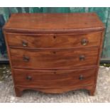 A 19th Century crossbanded mahogany bow-front chest-of-drawers, three graduated drawers, in two