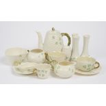 A large collection of Belleek porcelain, with shamrock and clover decoration, including a coffee