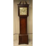 A 19th Century oak and mahogany longcase clock by J. Jones of Carnarvon, eight day movement,