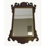 A 19th Century mahogany inlaid fret carved mirror, bevelled plate, gilt slip, 39.5 cm wide x 65.5 cm