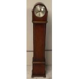 A 20th Century oak cased grandmother clock by Enfield, circular dial, Arabic numerals, two barley-