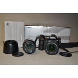 An Olympus E-1 Four-Thirds DSLR Camera, and Zuiko Lenses serial no 500009699, battery present, no