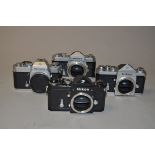 A Group of Nikkormat and a Nikon F SLR Bodies, a black Nikon F, serial no 6951635, shutter