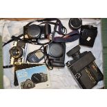 An Olympus OM-2 MD SLR Camera and Canon EOS Bodies, serial no 400811, shutter working with a Zuiko