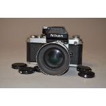 A Nikon chrome F2 SLR Camera, serial no. 8034968, with Nikkor f/2.8 28mm lens, serial no. 382991, P,